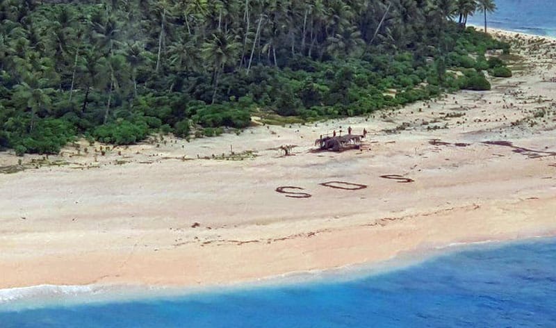 SOS spelled out on beach by castaway fishermen