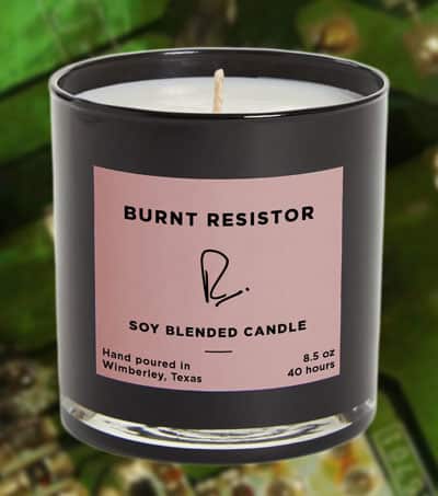 Candle with label identifying the scent as "burned resistor"