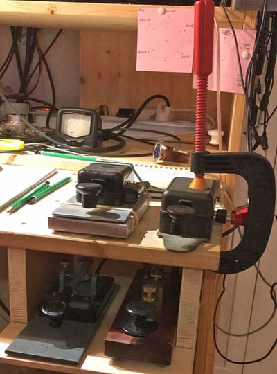 Funny photo of Morse key secured to desk with massive C-clamp