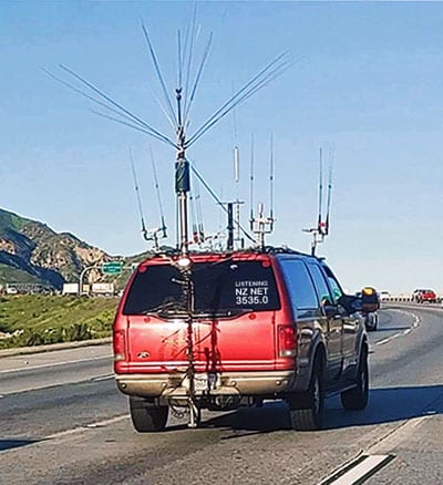 SUV with lots of radio aerials and sign reading 'Listening NZ Net 3535.0'