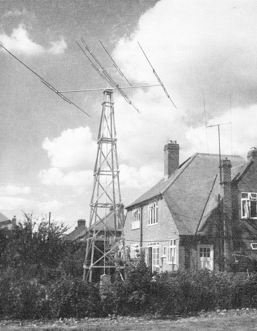 Old fashioned radio tower and yagi beside English house