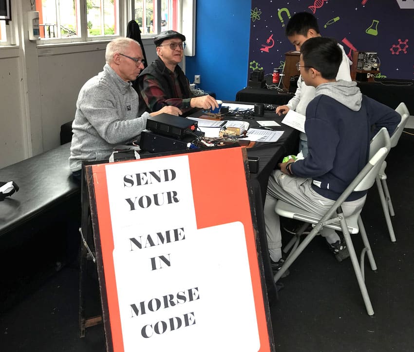 Martin ZL1MDE and Steve ZL1TZP help Morse learners with their skills at Museum of Transport and Technology (MOTAT) in Auckland