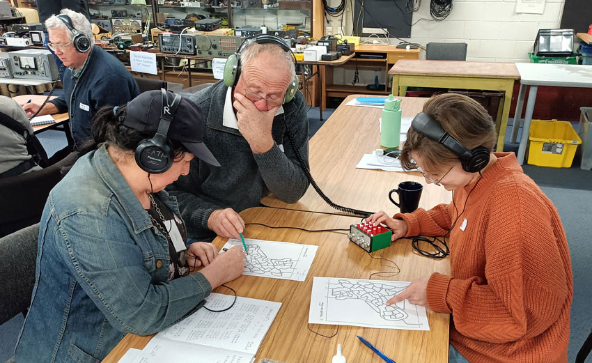 Students doing a Morse Code activity during MorseCram, July 2024 at Christchurch Amateur Radio Club