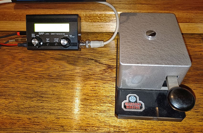 QRP Labs QMX transceiver on desk beside much larger Marconic 365EZ morse key