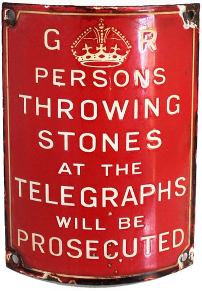 Warning sign on British telegraph pole says persons throwing stones at the telegraphs will be prosecuted