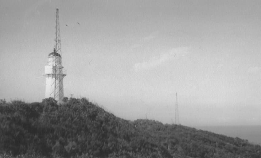 East Cape Lighthouse with two radio towers in the 1960s