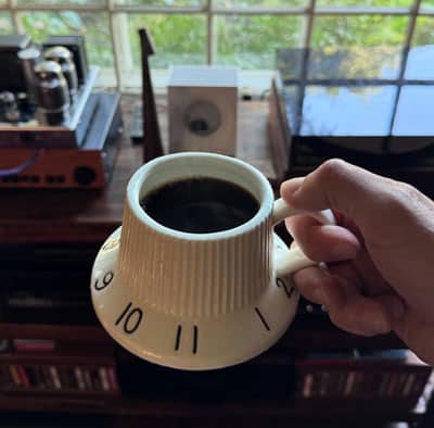 Coffee mug shaped like volume or tone control know of an old electric guitar