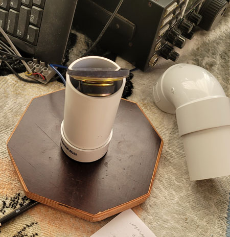Acoustic filter made of PVC pipe, disassembled to show location of small loudspeaker