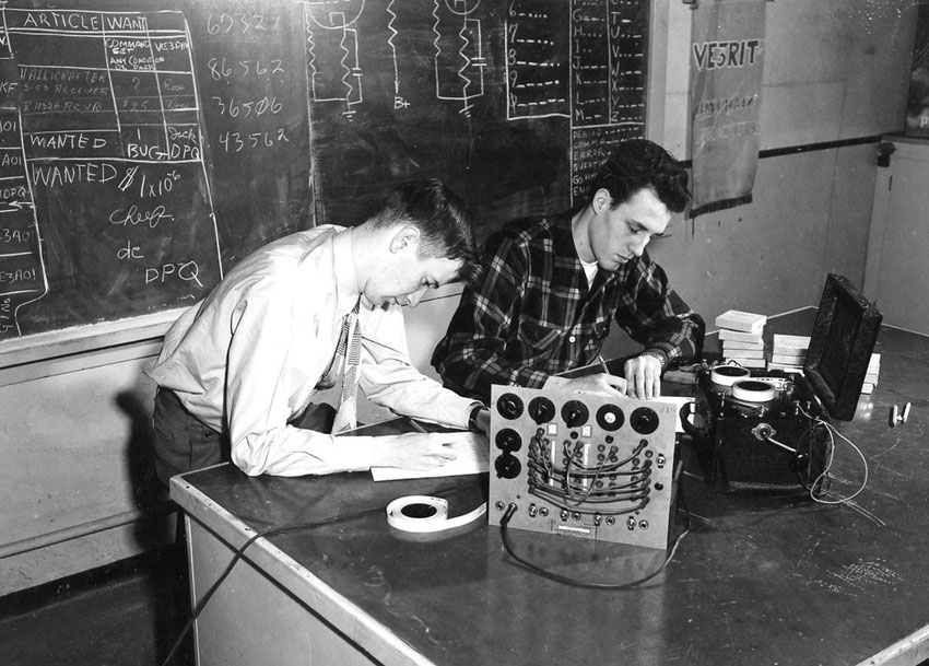 Two young men practising Morse Code with an Instructograph machine at VE3RIT Ryerson Institute of Technology
