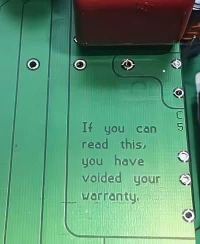 circuit board says 'if you can read this you have voided your warranty"