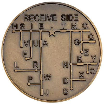 Bronze medallion with international morse code presented in a tree of dits and dahs