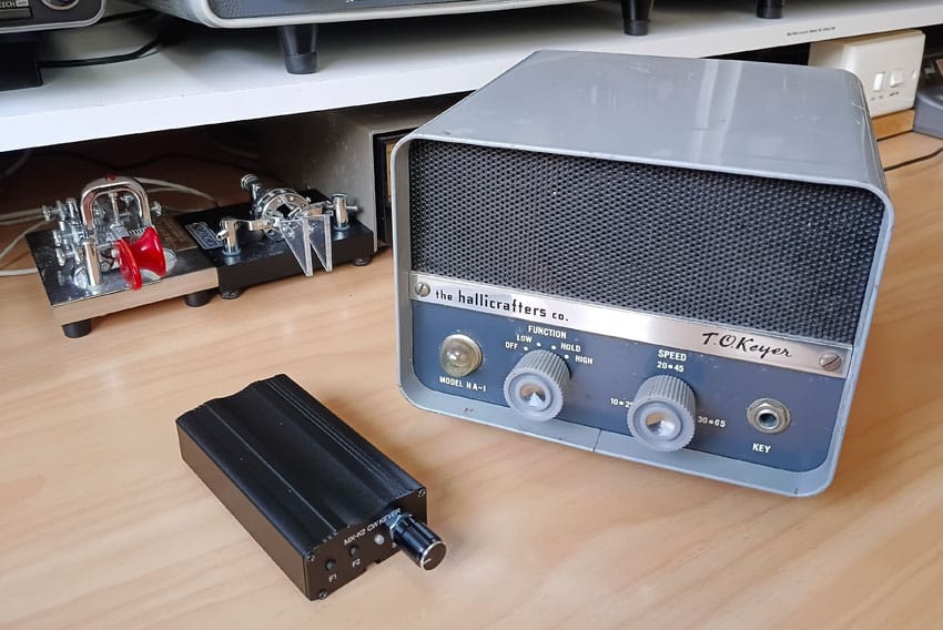 Tiny MX-K2 keyer beside much larger HA-1 keyer
